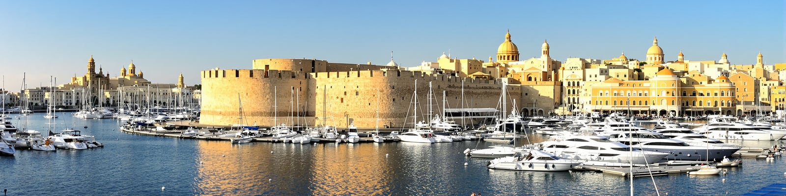 Grand Harbour Malta — limestone bastions above the superyacht marina, yacht wine delivery by Onshore Cellars