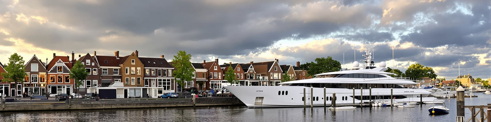 Dutch waterfront with a new-build superyacht at the fitting-out quay, yacht wine supply in the Netherlands by Onshore Cellars